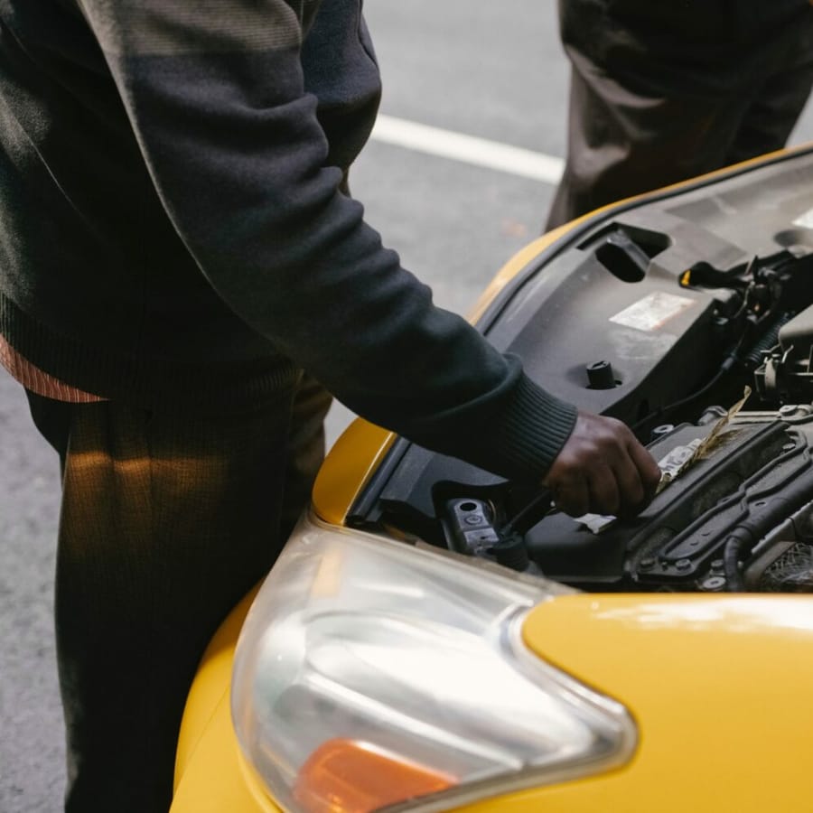 Car with a dead battery on the side of the road