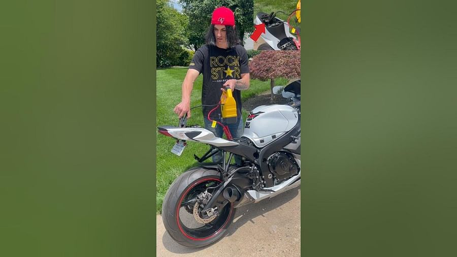 Motorcycle rider attempting to jump start his bike